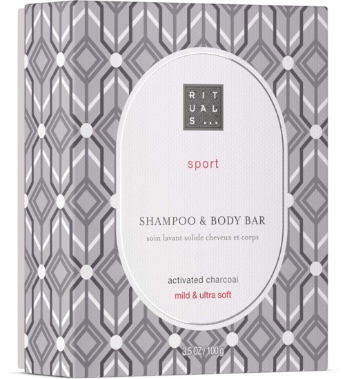 A soap box with a geometric gray pattern, label says 'Rituals sport shampoo & body bar, mild & ultra soft, activated charcoal.'