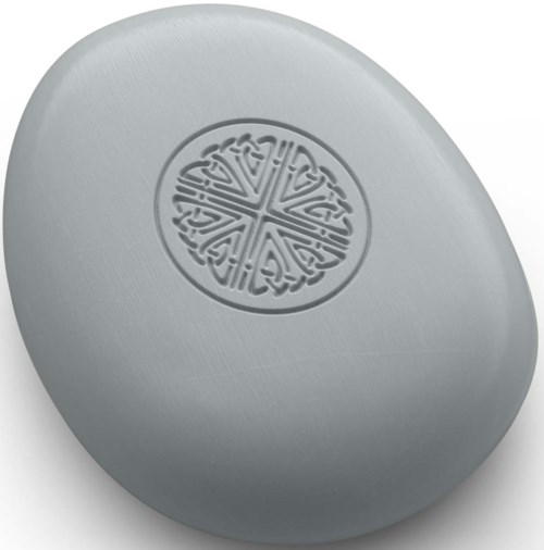 A smooth, flat stone with a decorative circular pattern in the center.