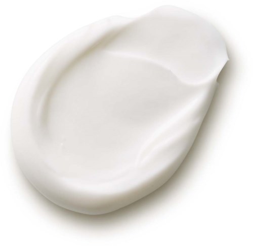 Eine weiße, ovale Nocke aus cremiger oder lotionartiger Substanz mit glatter Oberfläche.