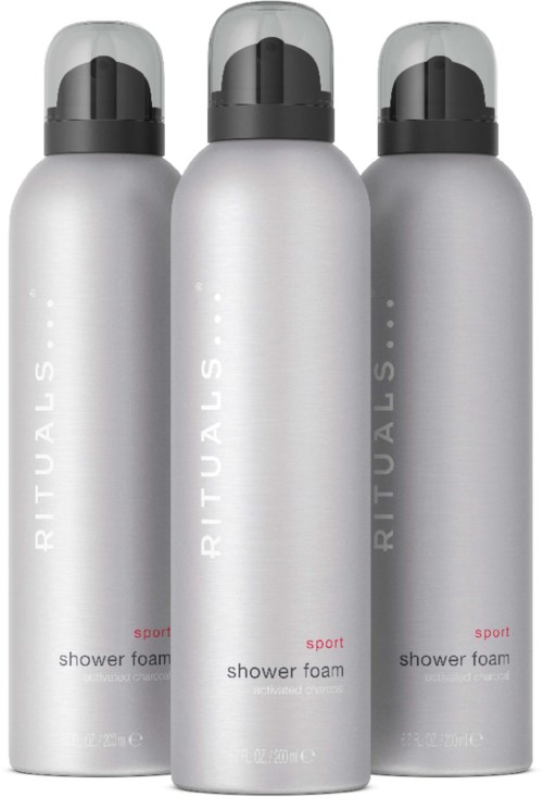 Three silver cans of Rituals shower foam with black caps are lined up. They are labeled "sport" on the bottles.