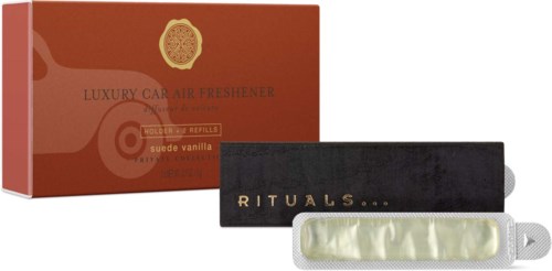 Svart Rituals-konvolutt med gullig tekst og en beige billukter med oransje emballasje.