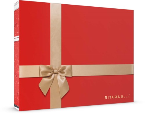En röd presentförpackning med beige rosett och band, märkt 'RITUALS...'.