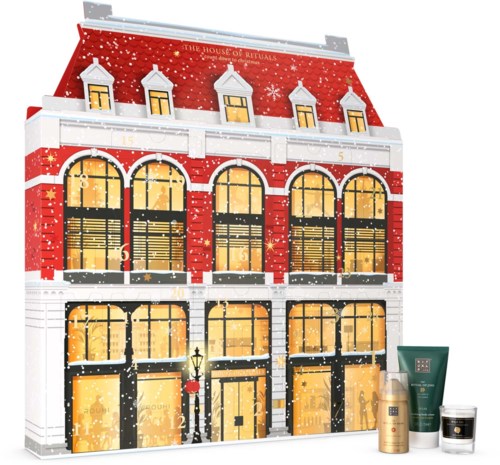 Ett festligt julkalenderformat som ser ut som en färgglad byggnad med dekorerade fönster, snö och juldekorationer.