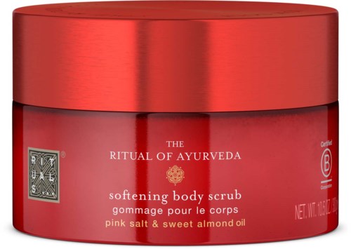 Roter Behälter mit Ayurveda-Körperpeeling aus Salz und Mandelöl, beschriftet 'Ritual of Ayurveda.'