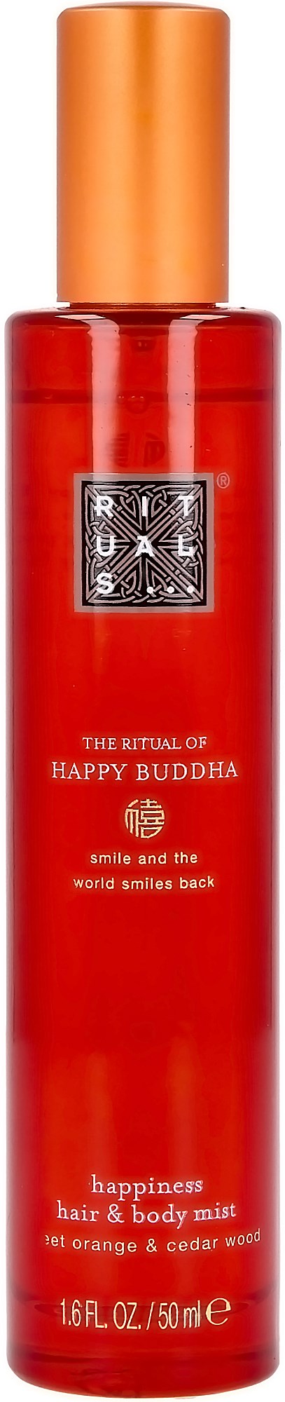 Röd sprayflaska med guldlock, märkt 'The Ritual of Happy Buddha' hår- och kroppsspray, doft av apelsin och cederträ.
