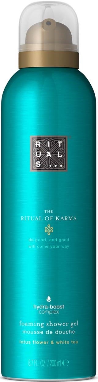 A blue bottle of Ritual of Karma foaming shower gel with a clear cap and gold band.