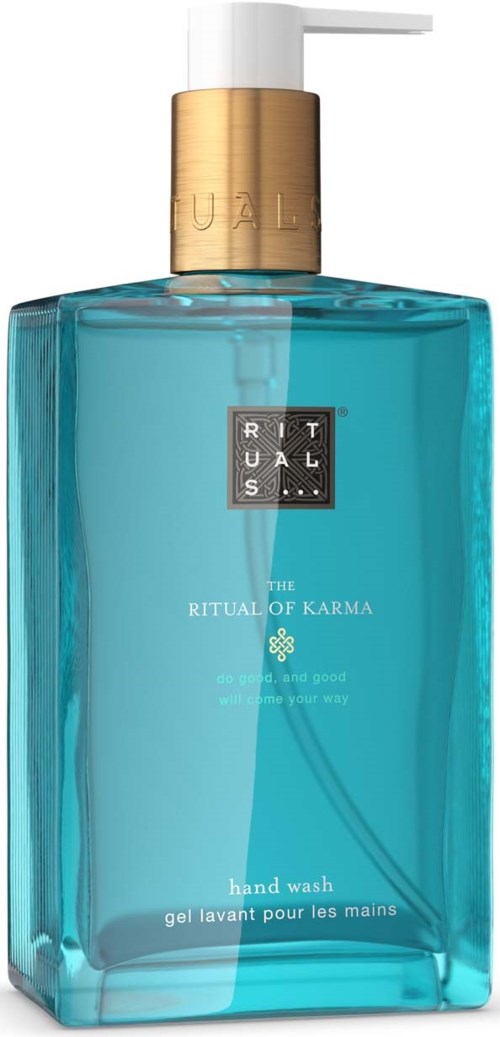 Eine blaue Ritual of Karma Handseifenflasche mit goldener Pumpe und weißen Details.