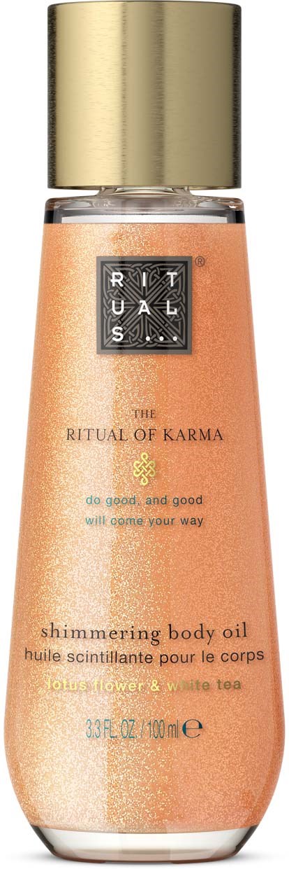 Eine Flasche mit schimmerndem Körperöl, goldener Deckel und pfirsichfarbiger Flüssigkeit, bezeichnet The Ritual of Karma.