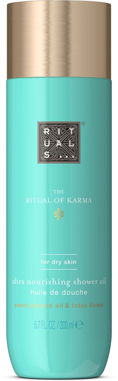 Eine türkisfarbene Flasche mit goldener Kappe, etikettiert als Ritual of Karma Duschöl für trockene Haut mit Mandel und Lotusblume.