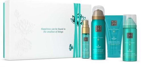 Hautpflegeproduktset mit türkiser und goldener Verpackung, einschließlich Flaschen und Tube, mit weißem Karton im Hintergrund.