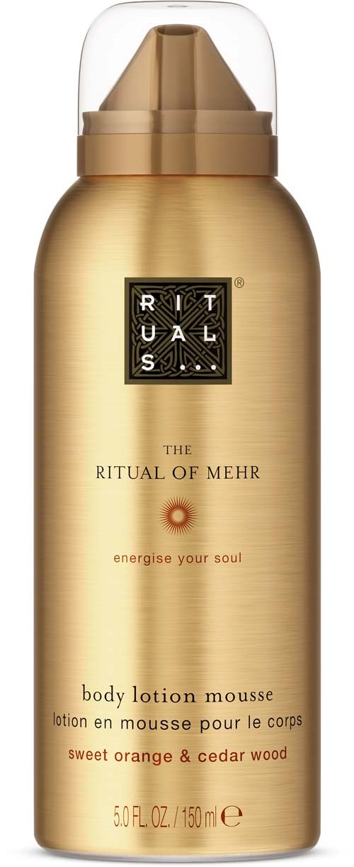 A gold spray can of body lotion, labeled Ritual of Mehr with scent of sweet orange and cedar wood.