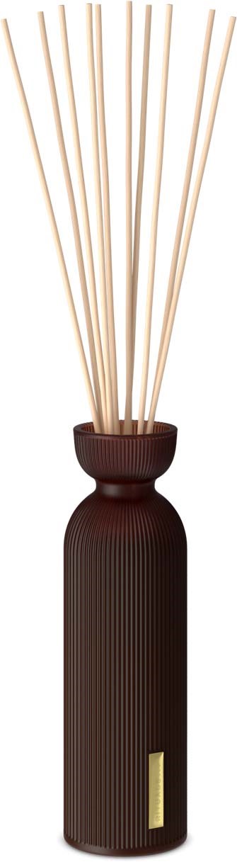 A dark brown diffuser with long sticks sticking out at the top. It has a small gold label on the front.