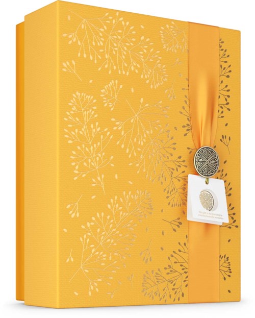 A yellow gift box with a floral pattern and an orange ribbon with a medallion.