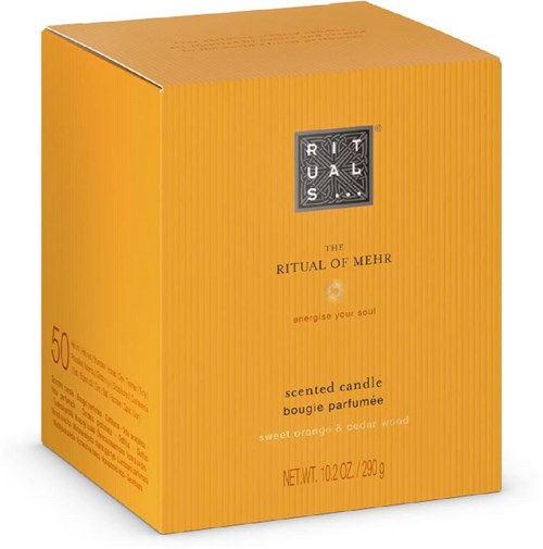 The box is orange with black and white text, and it contains a scented candle with sweet orange and cedar wood.