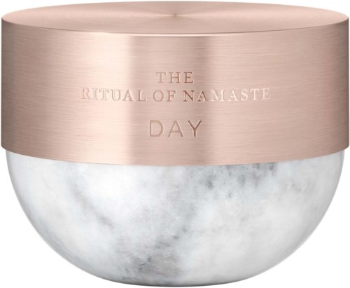 A round container with a pinkish lid, engraved with the words 'The Ritual of Namaste Day'.