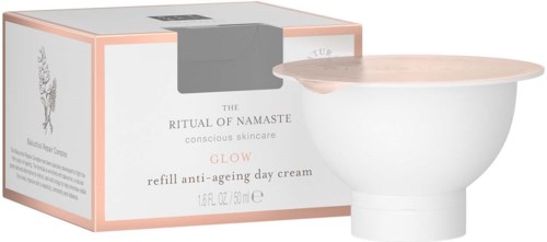A box and small bowl of skincare cream, labeled as anti-aging day cream with a light-colored lid.