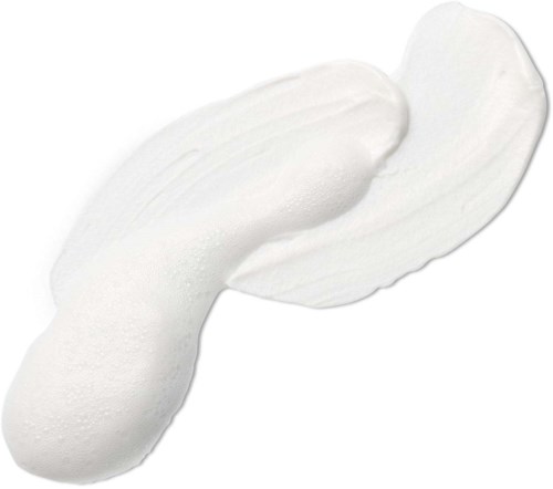 Weiße Creme oder Lotion auf einer Oberfläche, mit einer dickeren, gekrümmten Form.