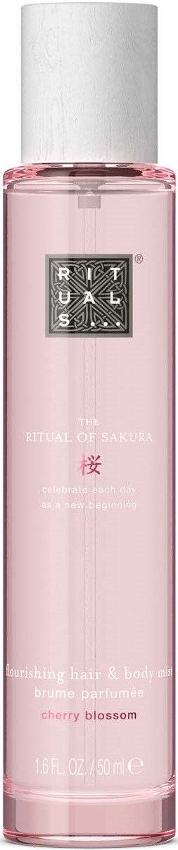 Eine lange, rosa, zylindrische Flasche mit silberner Kappe, beschriftet Rituals, Duft von Kirschblüte.