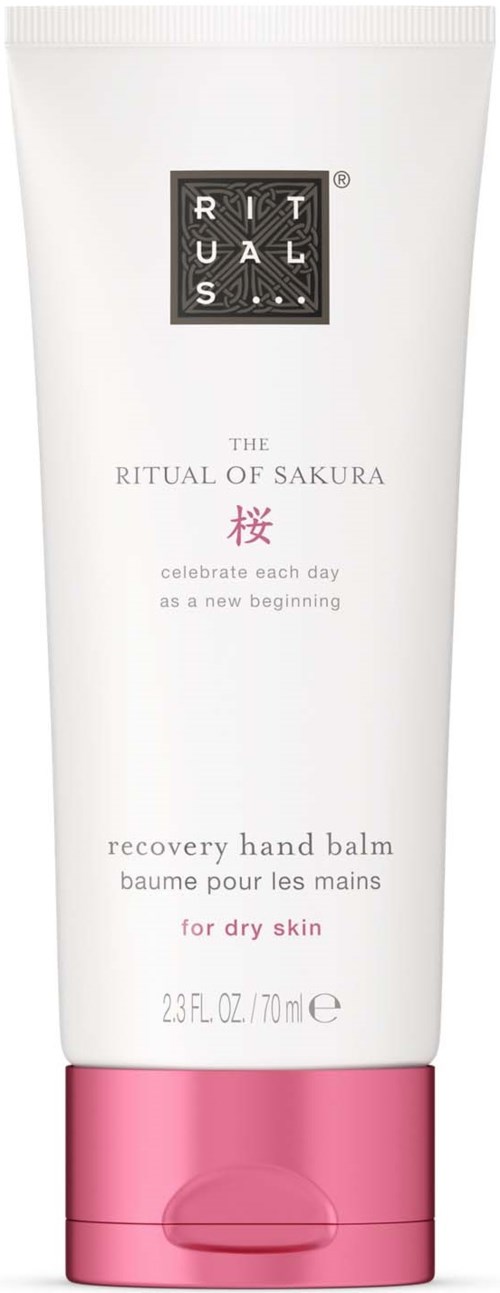 En vit tub med rosa botten, märkt som hand balm för torr hud, med en svart logotyp och fin text.
