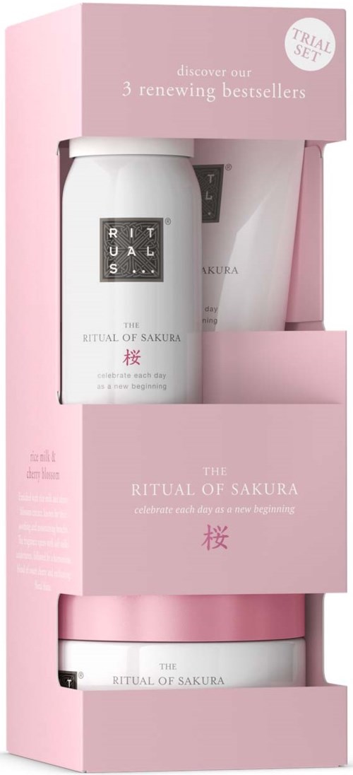 Ein Hautpflege-Set mit Creme und Lotion in rosa-weißer Verpackung, feiert einen Neuanfang. Beschriftung: 'The Ritual of Sakura.'