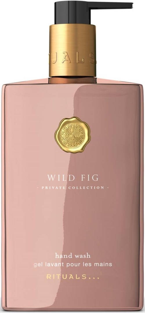 En rosa håndvaskflaske med svart pumpe, gullmerke og gull-emblem, del av Wild Fig-samlingen.