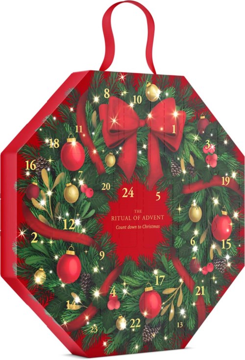 A Christmas-themed Advent calendar shaped like a hexagon, decorated with red and gold ornaments, bows, and greenery.