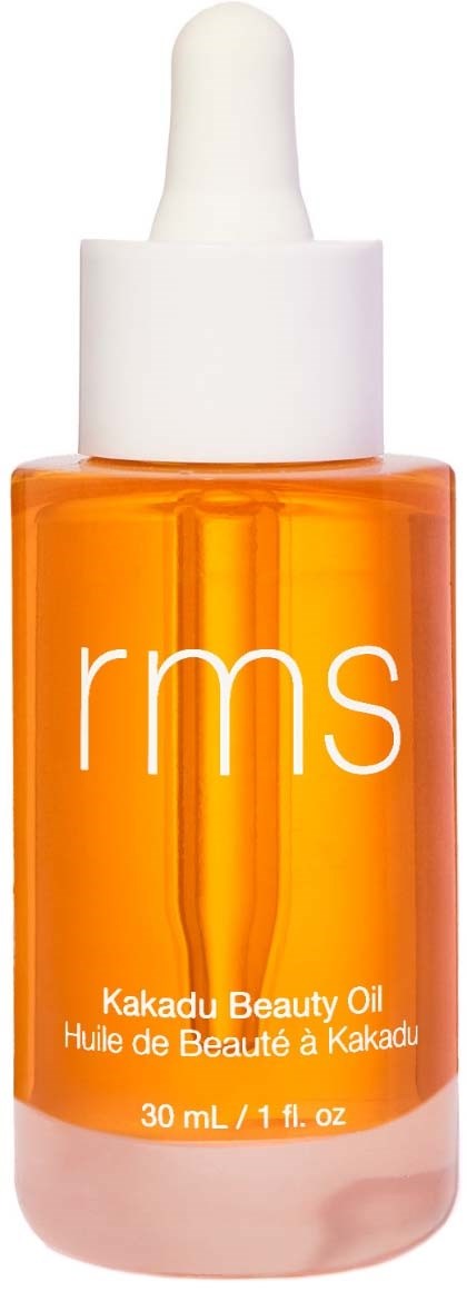 Orange Flasche mit weißem Tropfenzieher und 'rms'-Logo, gekennzeichnet als Kakadu Beauty Oil.