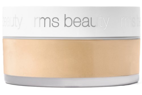Ein runder Behälter mit weißen, goldenen und silberfarbenen Tönen, beschriftet "rms beauty."