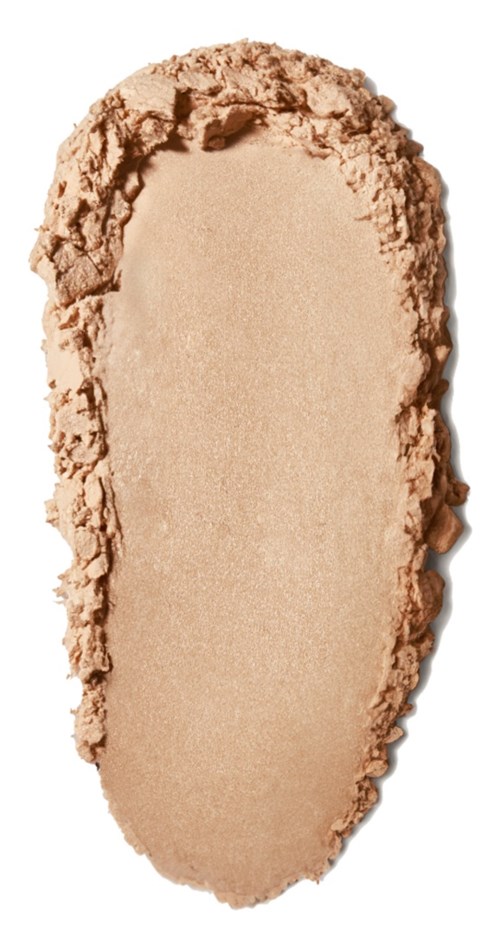 Beige Pulverspread in ovaler Form mit rauen Kanten, vermutlich Make-up oder Kosmetika.