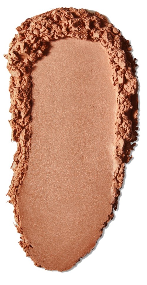 Beige Pulver mit ungleichmäßigen Rändern, wahrscheinlich Kosmetikprodukt.