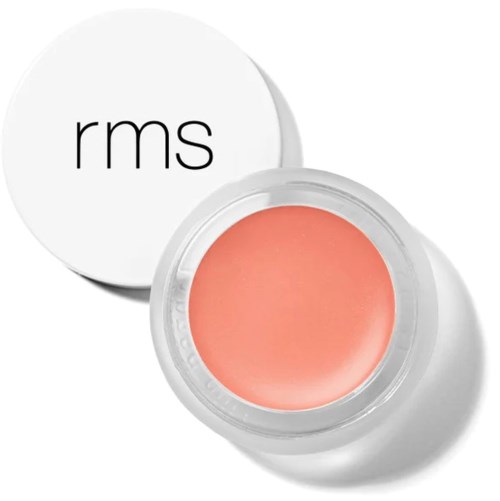 Ein runder Behälter mit rosa Creme darin und einem weißen Deckel mit "rms" geschrieben.