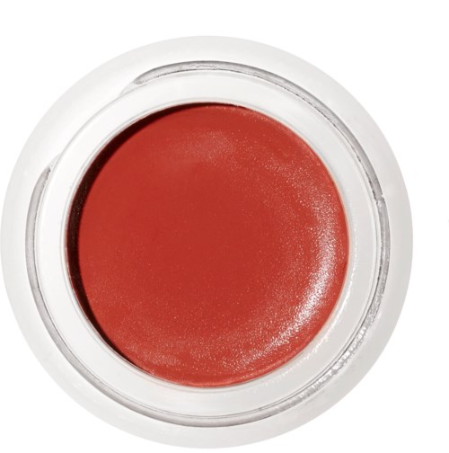 Ein kleiner Behälter mit rotem Lippenstift oder Farbe, mit durchsichtigem Deckel.