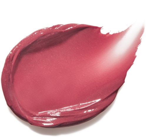 Ruus lipstick-jälki valkoisella pinnalla, sileä pinta, kiiltävä ulkonäkö, kaareva muoto.