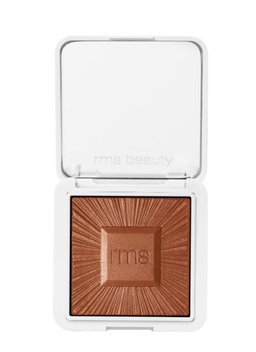 Ein kompakter Make-up-Blush mit bronzefarbenem Produkt in einer weißen Hülle.