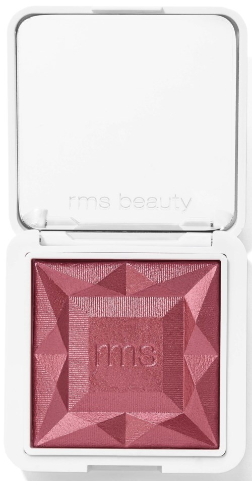 Ein rosa Rouge mit geometrischem Muster in einer weißen Kompaktbox. Der Deckel hat einen Spiegel, ohne sichtbaren Text.