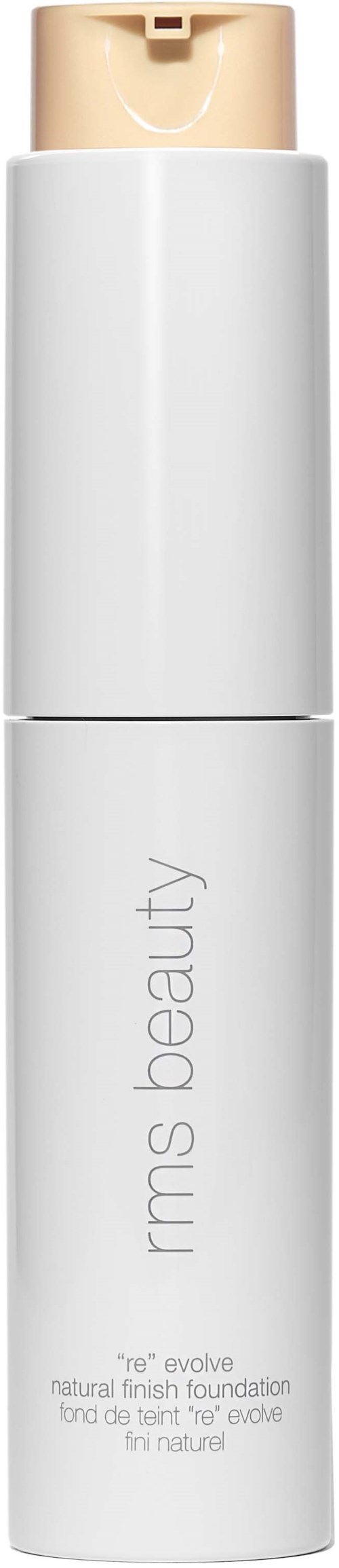 Eine weiße Flasche mit beigem Deckel, beschriftet 'rms beauty re-evolve', ist eine Foundation für natürlichen Look.
