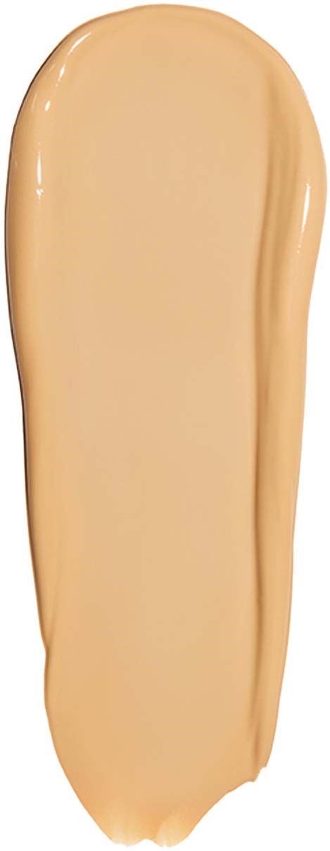 Ein Klecks beige flüssiges Make-up oder Foundation auf schwarzem Hintergrund.