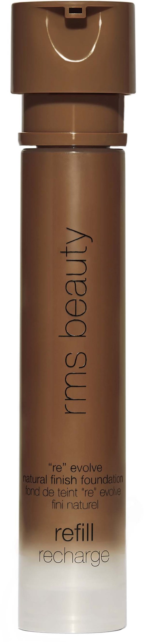 Eine braune zylindrische Flasche mit Drehverschluss, beschriftet 'rms beauty,' für Foundation-Nachfüllung. Einfaches, elegantes Design.