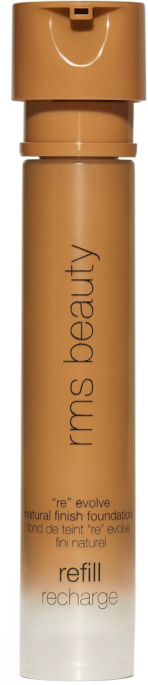 Eine zylindrische Flasche mit Pumpe, beschriftet 'IRMS beauty,' für Foundation-Nachfüllung, in beiger Farbe.