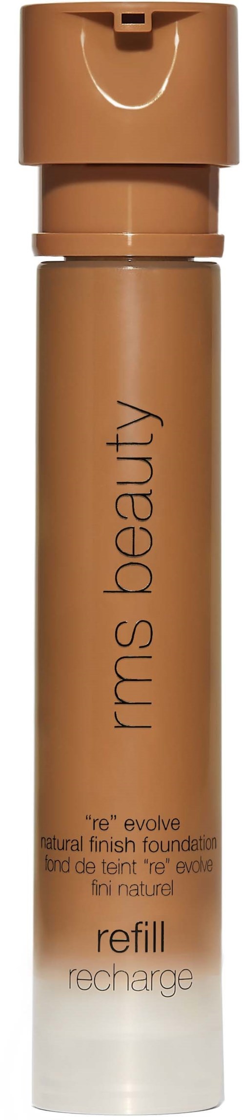 Eine zylindrische Make-up-Flasche in Beige mit Pumpe, beschriftet 'kma's beauty'.