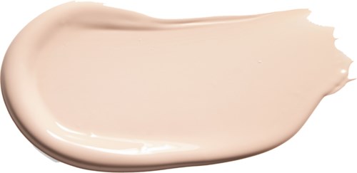 Eine glatte, hellbeige Creme oder Lotion auf schwarzem Hintergrund.