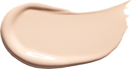 Ein Creme- oder Foundationstrich mit glatter, leicht gebogener Form auf schwarzem Hintergrund.