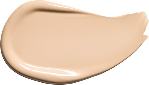 Beige flüssige Creme in Löffelform, glatt und glänzend. Wahrscheinlich Foundation oder Make-up.
