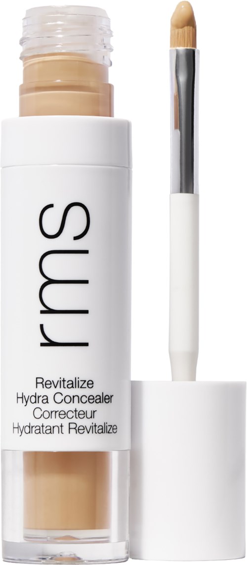 Ein Concealer-Stick mit weißem Deckel und "rms" auf der Tube, zeigt beige Produkt innen.