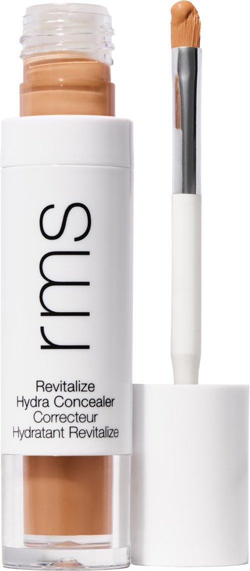 Ein Concealer-Stift mit weißem Deckel und beigem Produkt, beschriftet 'rms' und 'Revitalize Hydra Concealer,' mit Applikator.