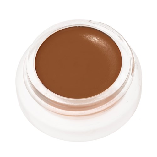 Ein kleiner Behälter mit brauner Creme oder Make-up, von oben mit weißem Deckel.