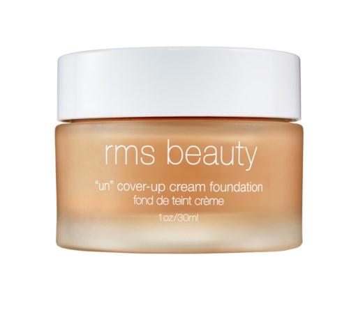 A jar of RMS Beauty 'un' cover-up cream foundation with a white lid and beige container.