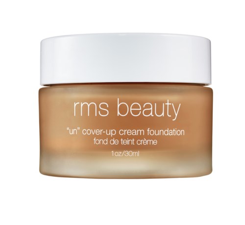 A jar of RMS Beauty 'un' cover-up cream foundation with a white lid and beige container.