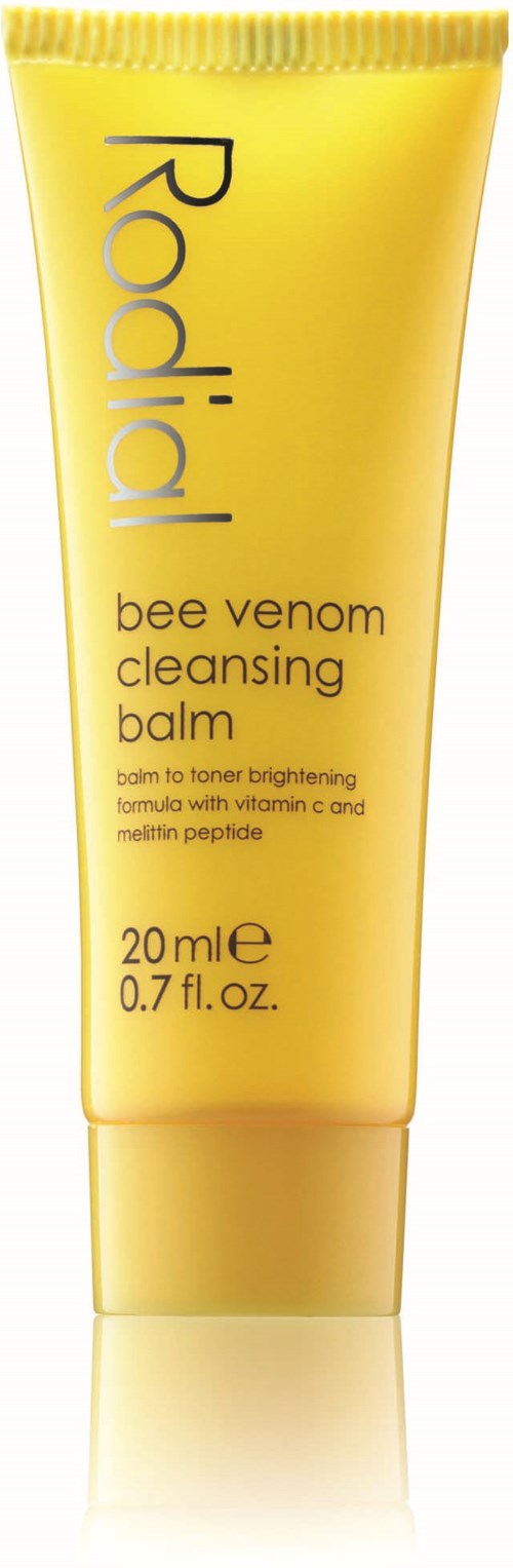 Yellow tube of Radial bee venom cleansing balm with text on it, including brand name and description.