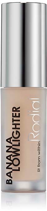 A tube of foundation makeup with silver cap and beige liquid inside. It is labeled "Banana Brightener" by Radial.
